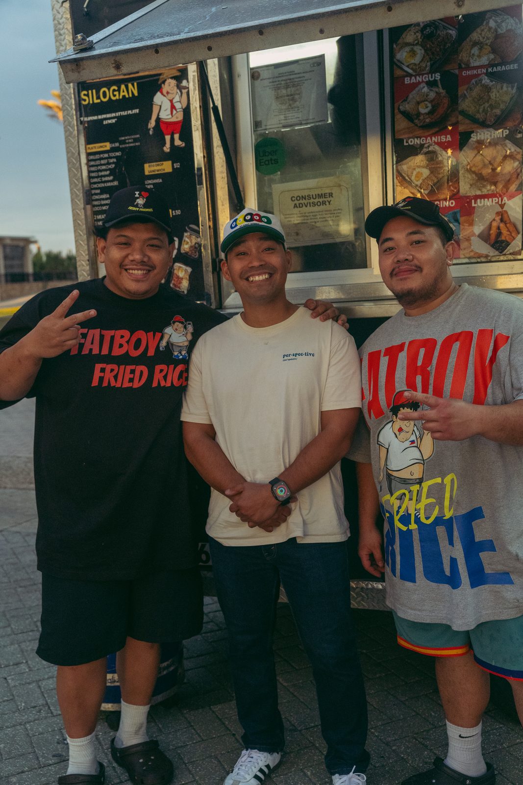 Three friends in front of Fatboy Fried Rice food truck